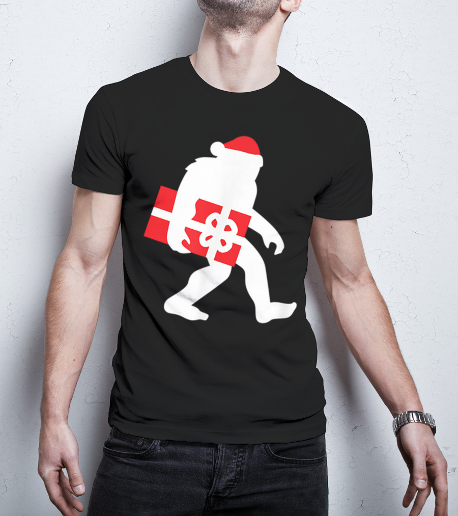 Nice Bigfoot Carrying Christmas Gift In Santa Hat T-Shirt