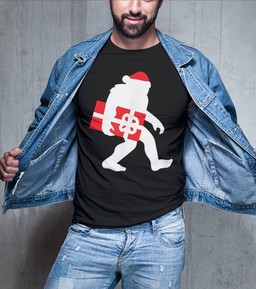 Nice Bigfoot Carrying Christmas Gift In Santa Hat T-Shirt