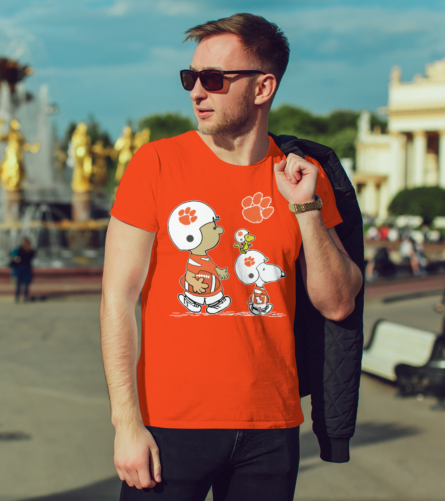Clemson Tigers Snoopy Football Helmets And Paw Print Charlie Brown Woodstock T-Shirt