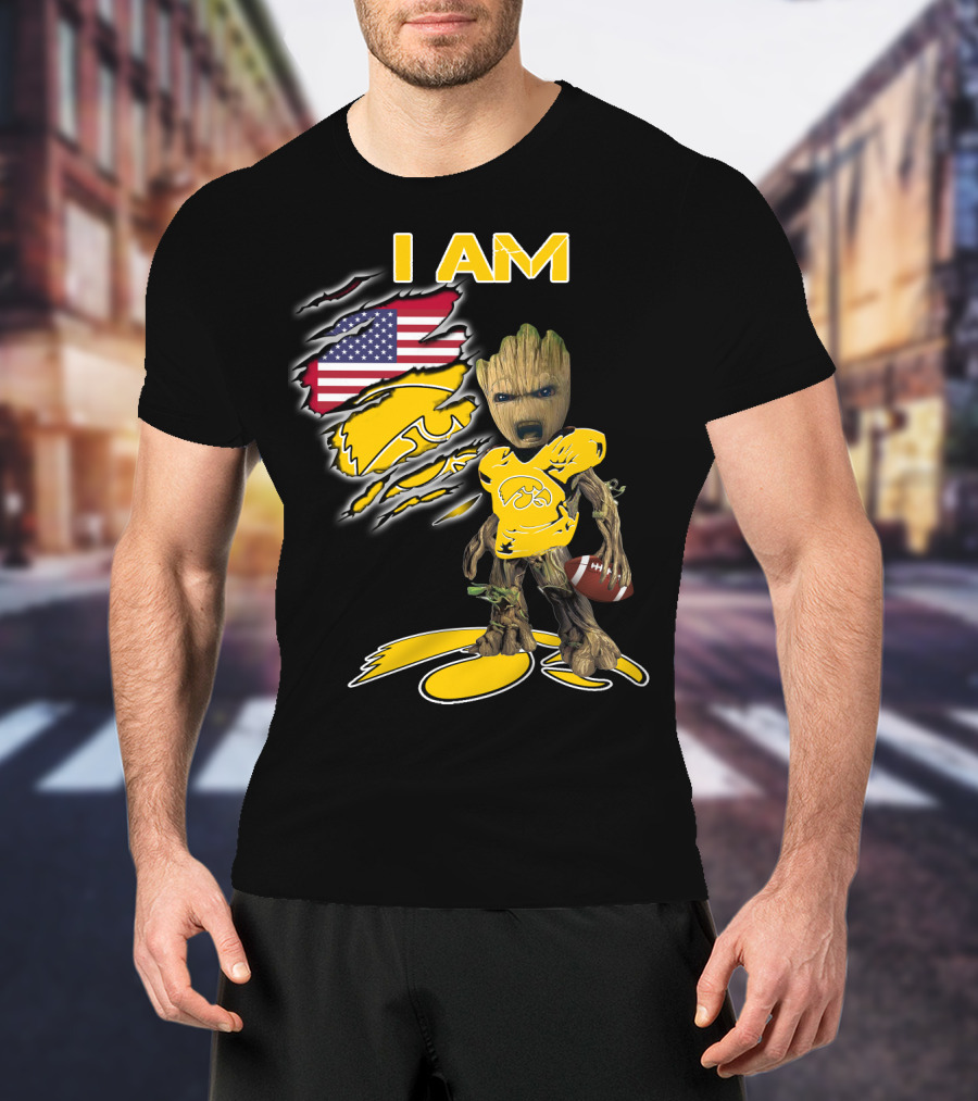 I Am Hawkeyes Baby Groot Holding Football With Usa Flag And Iowa Hawkeyes T-Shirt