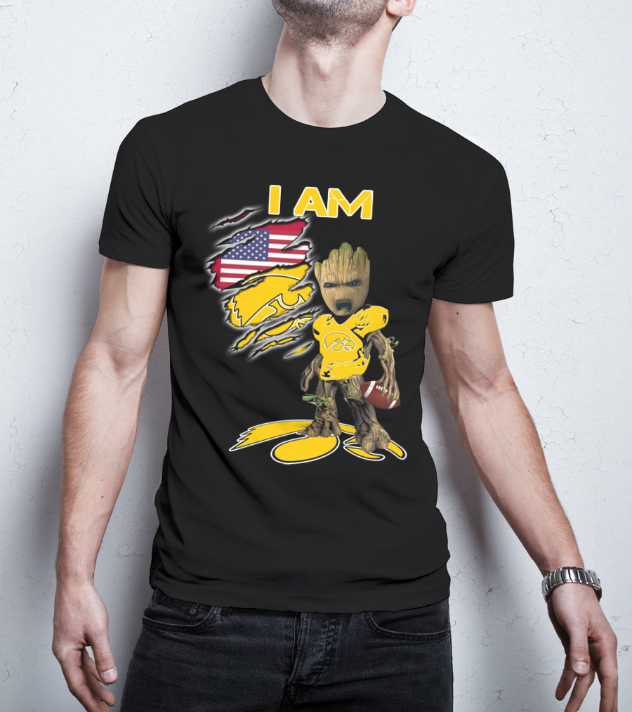 I Am Hawkeyes Baby Groot Holding Football With Usa Flag And Iowa Hawkeyes T-Shirt