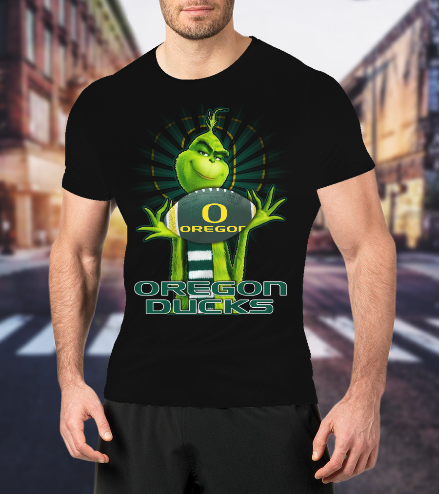 Grinch Holding Oregon Ducks Football T-Shirt