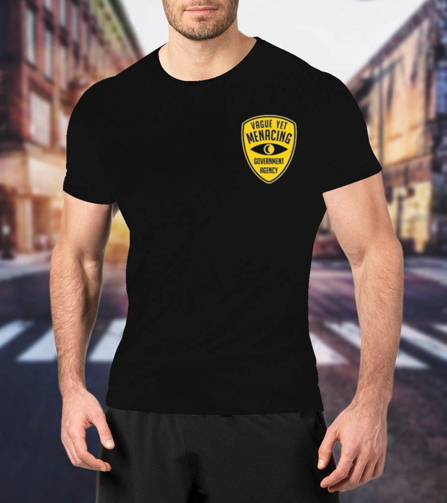 Vague Yet Menacing Government Agency Yellow Badge With Eye T-Shirt