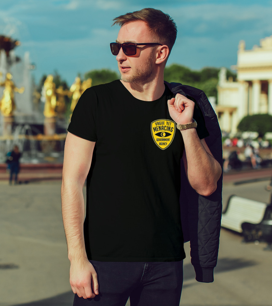 Vague Yet Menacing Government Agency Yellow Badge With Eye T-Shirt
