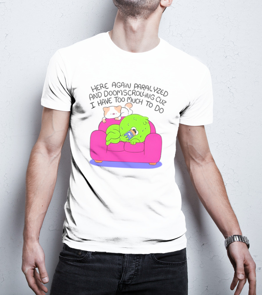 Here Again Paralyzed And Doomscrolling Cuz I Have Too Much To Do Quirky Green Figure Relaxing On Pink Couch With Cute Dog T-Shirt
