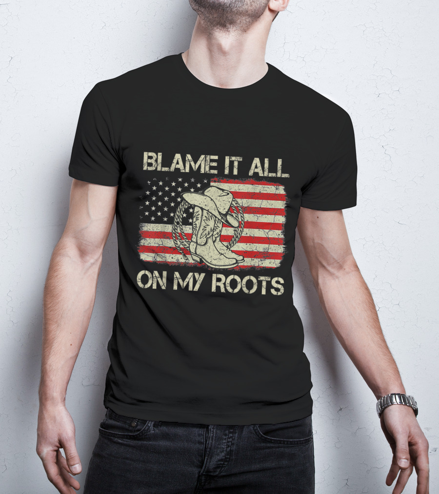 Blame It All On My Roots Cowboy Hat Boots American Flag Background T-Shirt