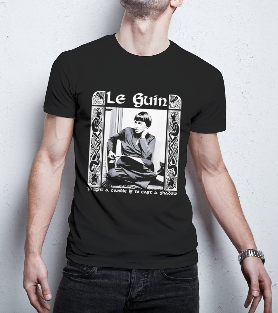Le Guin To Light A Candle Is To Cast A Shadow T-Shirt