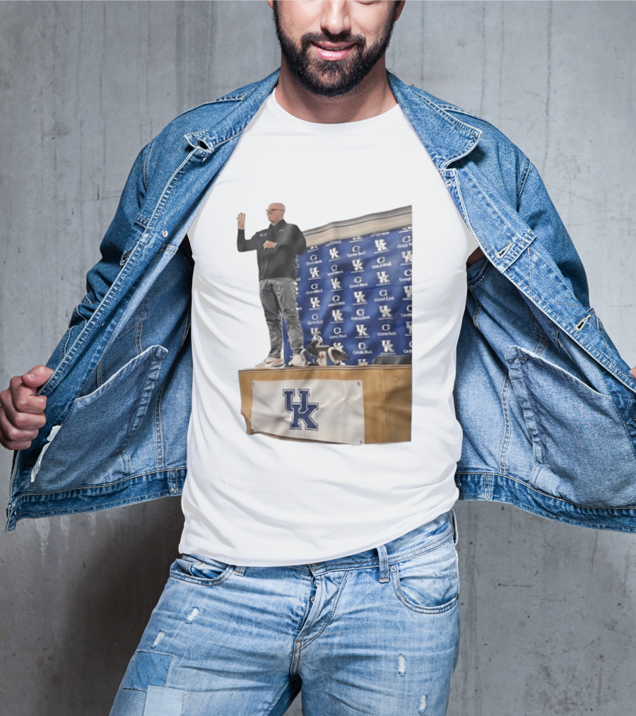 UK Volleyball Coach Craig Skinner Standing On Table With UK Logo And Awards T-Shirt