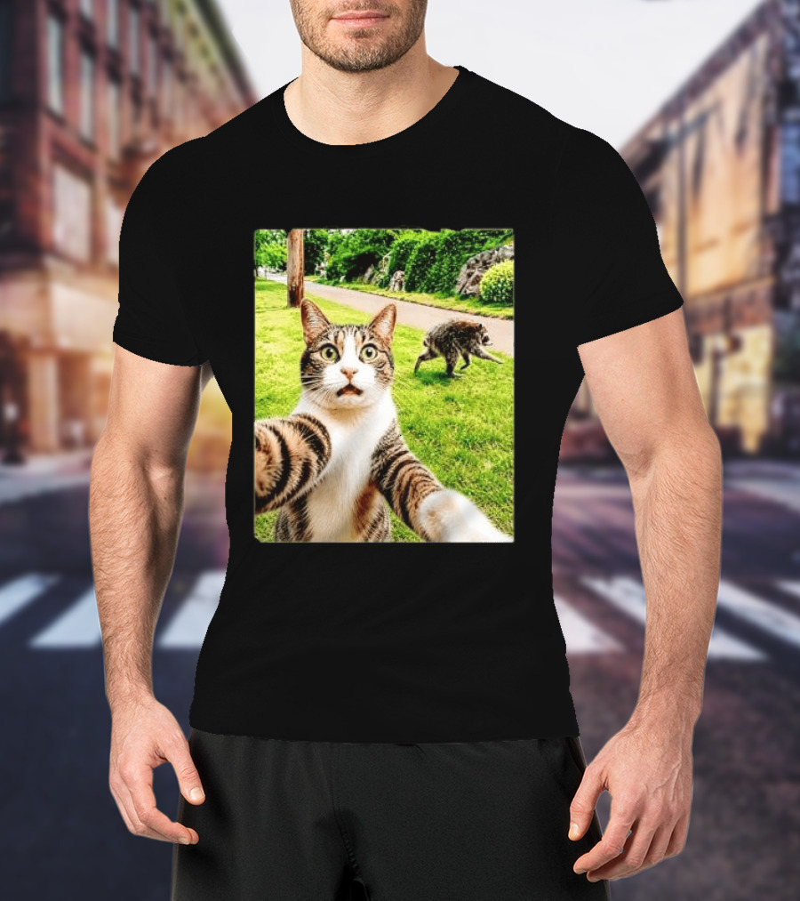 Shocked Face Tabby Cat Taking Selfie With Running Raccoon On Lawn Road T-Shirt