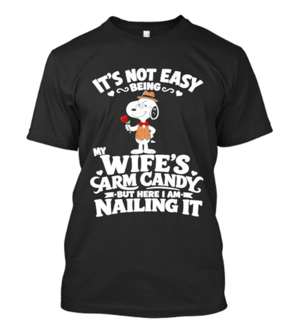 Snoopy It's Not Easy Being My Wife's Arm Candy But Here I Am Nailing It T-Shirt