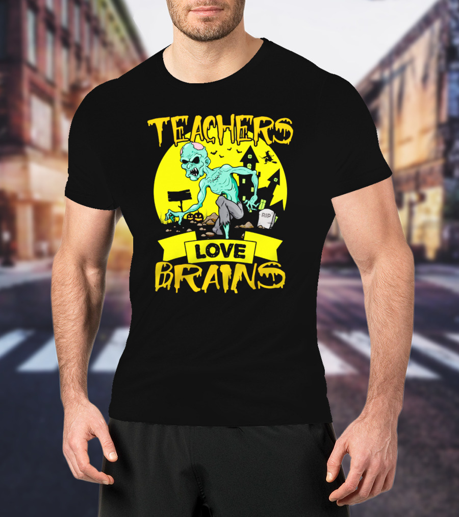 Teachers Love Brains Zombie Halloween Theme With Haunted Houses And Graveyard Background T-Shirt
