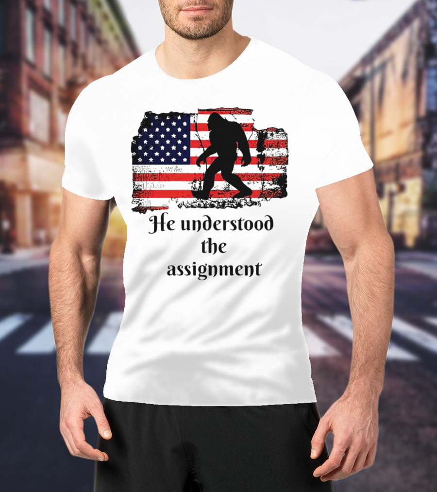Bigfoot Silhouette With Distressed American Flag He Understood The Assignment T-Shirt