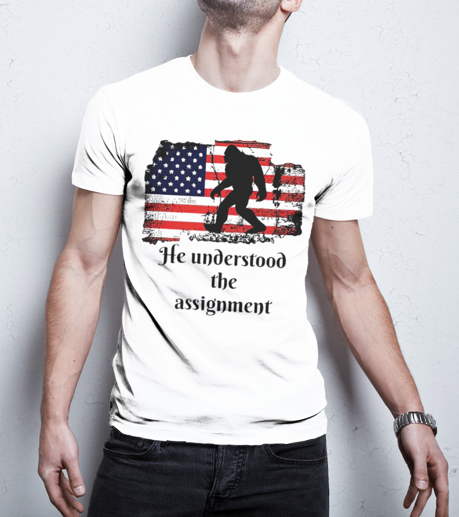 Bigfoot Silhouette With Distressed American Flag He Understood The Assignment T-Shirt