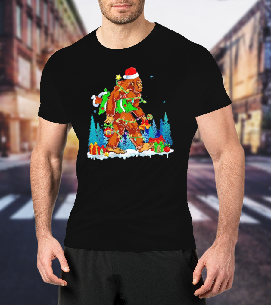 Bigfoot Santa Hugging Christmas Tree With Gifts And Snow Scene T-Shirt