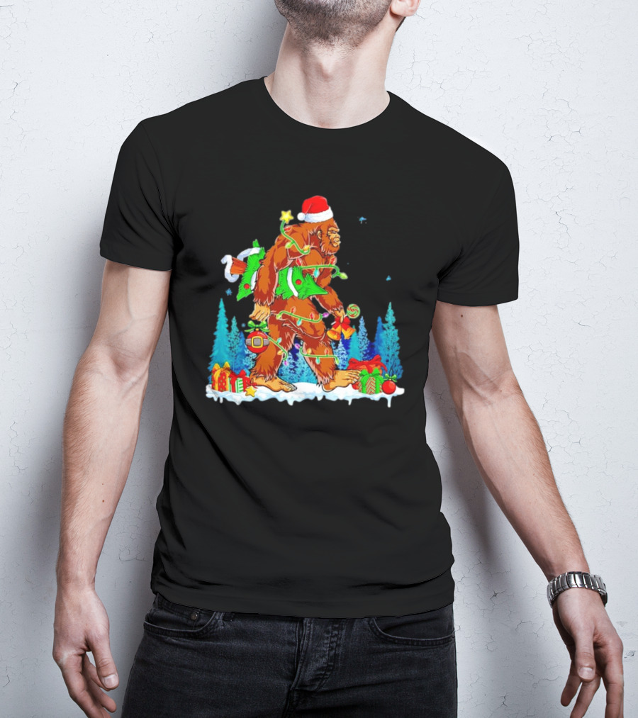 Bigfoot Santa Hugging Christmas Tree With Gifts And Snow Scene T-Shirt