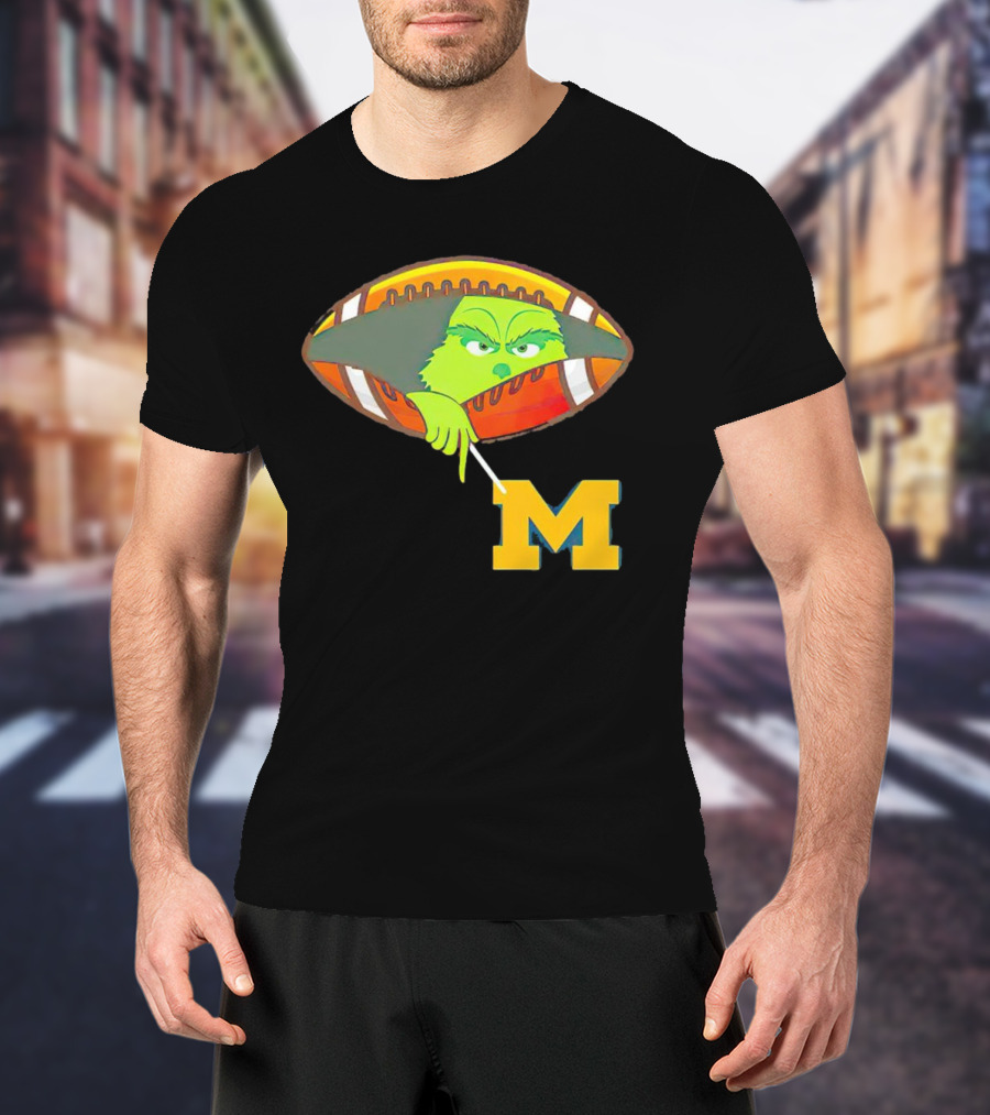 Grinch Peeking From Football Over Michigan Wolverines T-Shirt