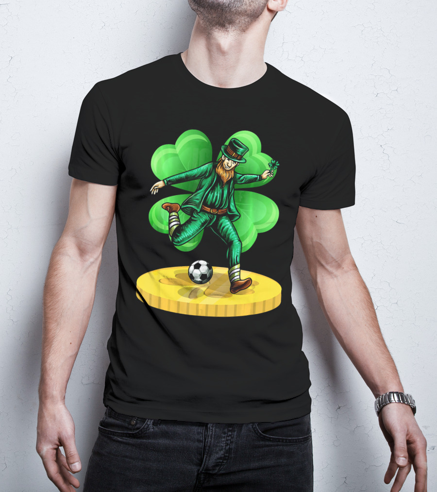 Leprechaun Kicking Soccer Ball On Gold Coin With Shamrock Background T-Shirt