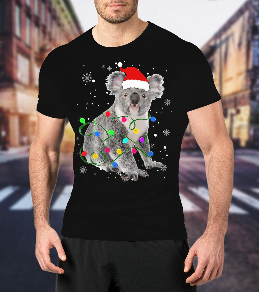 Koala Wrapped In Christmas Lights Wearing Santa Hat With Snowflakes Matching Fam T-Shirt
