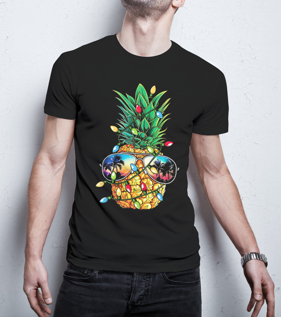 Pineapple Wrapped In Christmas Lights With Sunglasses Reflected Sunset And Palm Trees T-Shirt