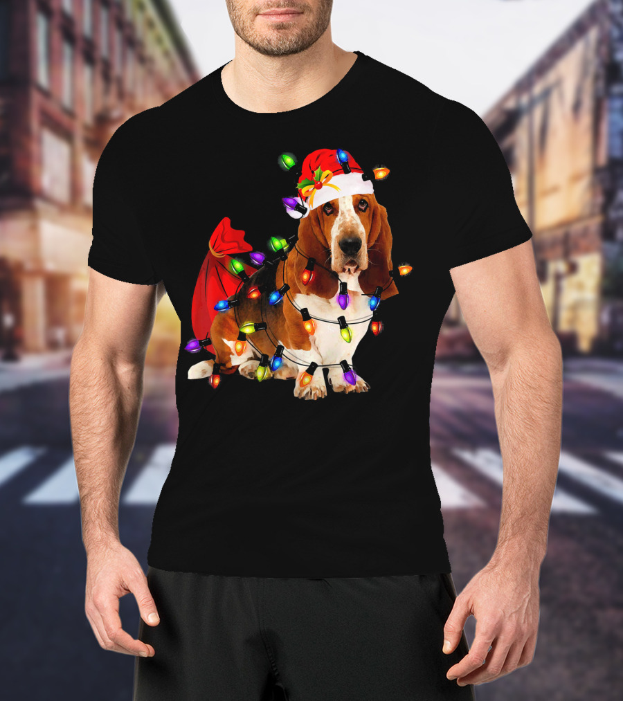 Basset Hound Wrapped In Christmas Lights With Santa Hat And Red Sack T-Shirt