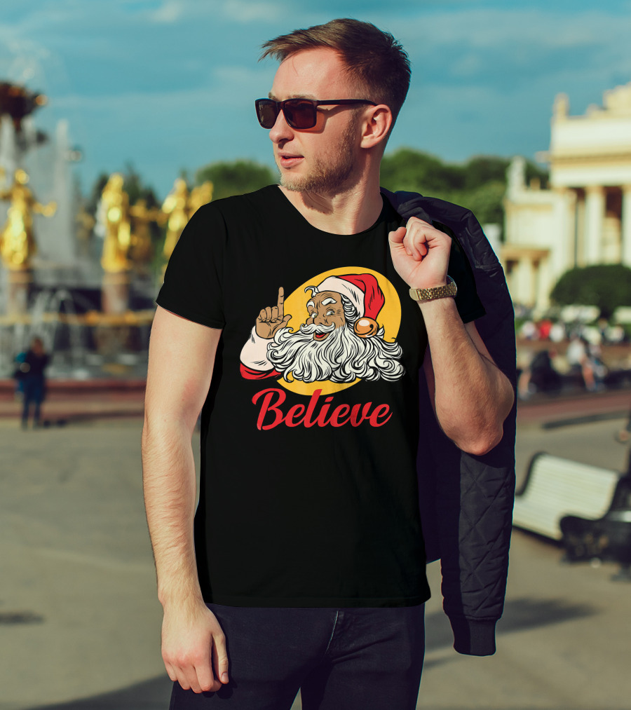 Black Santa Claus With Believe Caption And Yellow Background T-Shirt