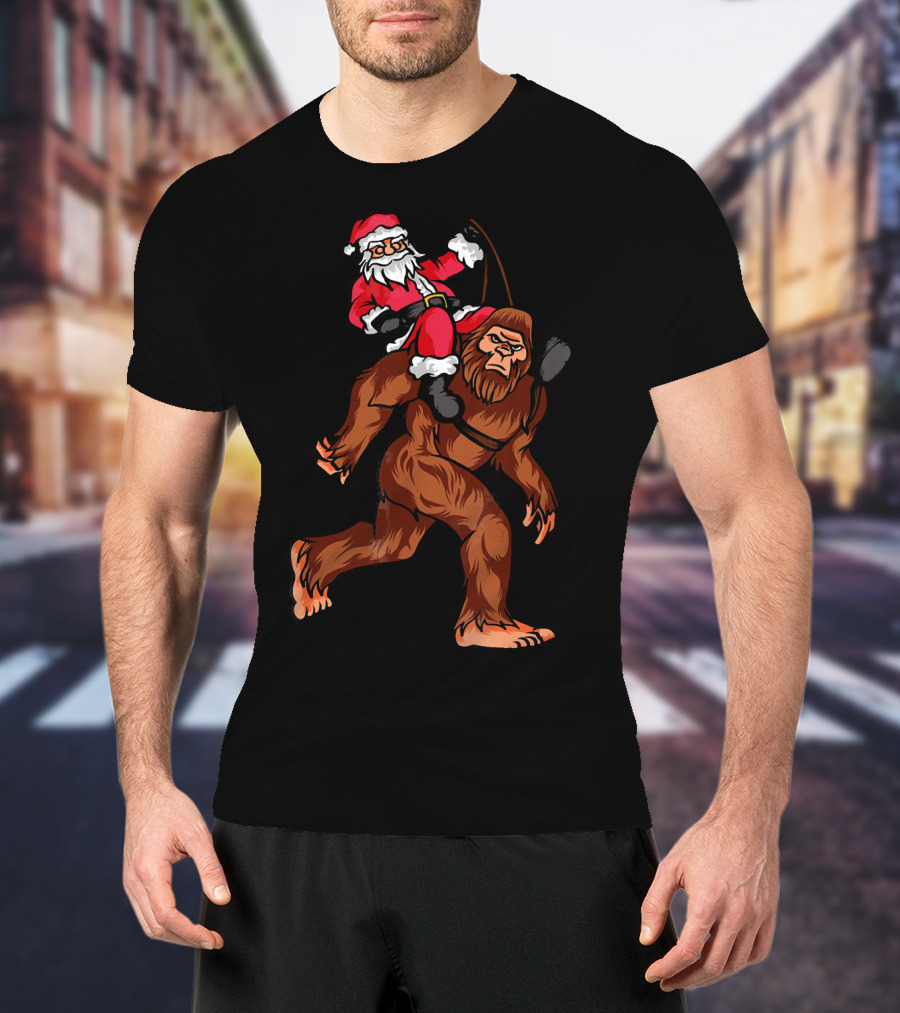 Bigfoot Carrying Santa Claus In Christmas T-Shirt