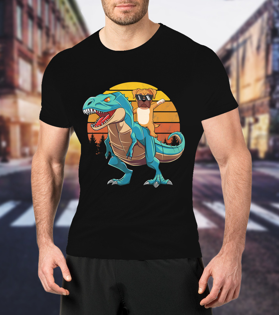 Boxer Dog With Sunglasses Riding Blue T-Rex Against Sunset Background T-Shirt